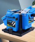 Game Changer Heavy Duty Multitask Electric Knife Sharpener And Scissor Drill Bit Chisel Grinder 96 Watt portable sharpener on wood table.