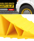 Heavy Duty Wheel Chocks 2 Pack For Trailers And RVs Non Slip Triangular Tire Blocks with double-sided serrated grip, yellow, in use.