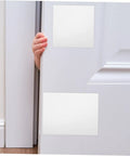 Self Adhesive PVC Siding Patch Kit with 10 Sheets applied on a door, showing white vinyl patches used for repair