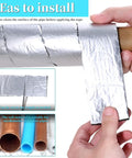 Person installing Outdoor Pipe Insulation Wrap Two Inch By Thirty Two Point Eight Feet with foam and foil on pipe