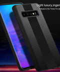 Black textured phone case for Apple iPhone X, featuring dual stripes and sleek design, standing against glowing blue screen background.