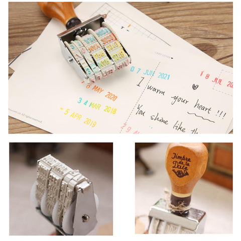 Premium Roller Date Stamp With Comfortable Wood Handle And Secure Grip Base Straight Up on planner with colorful dates stamped.