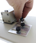 Adjusting the precision slide guides on the Heavy Duty Desktop Slot Punch For ID Cards And Bulk Badges.