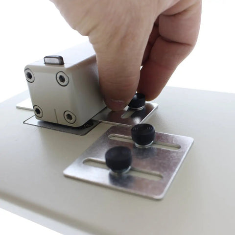 Adjusting the precision slide guides on the Heavy Duty Desktop Slot Punch For ID Cards And Bulk Badges.