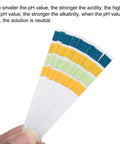 Hand holding pH Test Strips 0 To 14, 100 Indicator Papers Litmus Tester for acidity and alkalinity testing