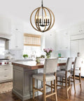 Orb 6 Light Farmhouse Chandelier In Brown Wood Finish with Globe design in kitchen above dining area