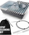 Hose And Mask Cleaning Kit with basin, drying rack, tubing brush, and storage bag for CPAP cleaning.