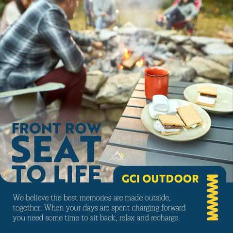 Compact Camp Table 20 for outdoor dining, foldable design with heat resistant top, holding snacks and drinks by campfire.