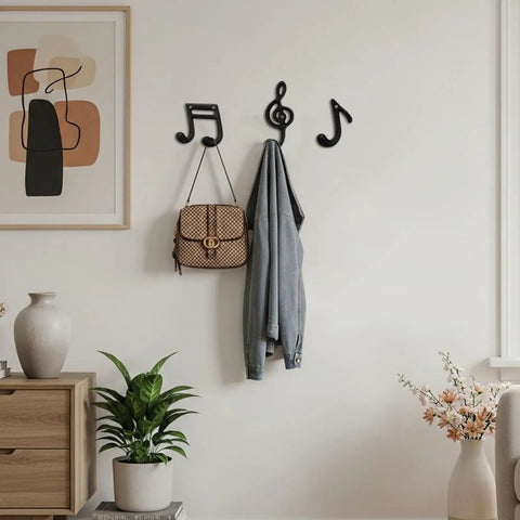 Fresh Black Cast Iron Musical Note Wall Hooks Set Of Three Decorative Coat Rack With Mounting Screws Hanging Clothes Bags And Keys In Music Room Or Kitchen Vibe, displaying a bag and jacket.