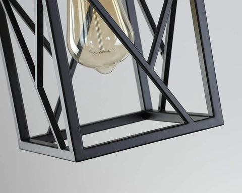Close-up of Black Industrial Pendant Light With Durable Metal Cage showing bulb detail and geometric frame