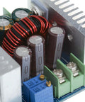 Close-up of a Beast Buck Converter Module 6-40V To 1.2-36V, 20A 300W Adjustable Step Down Regulator with heatsink and capacitors.