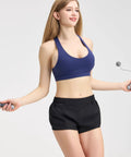 Woman skipping rope wearing Women's Running Shorts With Zip Pocket And Built In Liner, Quick-Dry Lightweight Two Point Five Inch Inseam, Low Rise Gym Yoga Athletic Shorts For Running Training And HIIT, Breathable Sweat-Wicking Black