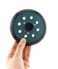 5 Inch 8-Hole Replaceable Oscillating Sanding Pad For Metal Finishing, held by hand, showing dust extraction holes