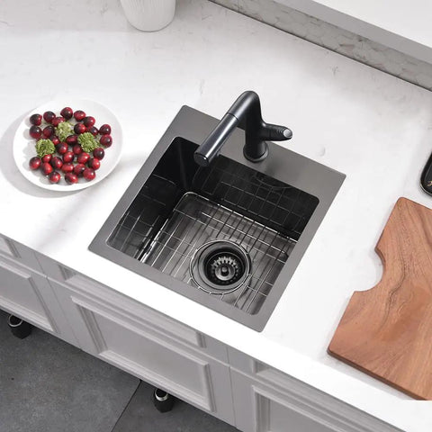Overhead view of 15 Inch Drop In Bar Sink With A Deep Bowl In 16 Gauge T304 Stainless Steel For Small Kitchens Or Wet Bars Top Mount Noise Reduction Outdoor RV Ready Includes Grid And Strainer.