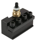 Badass Slick Quick Change Mini Lathe Tool Post Holder with brass fitting, four insert slots, compact design for quick cutter changes.