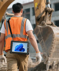 A worker in an orange vest carrying a Heavy Duty Windows 11 Rugged Tablet Featuring Knockout Intel Core I5 Speed and Plush 16GB RAM.