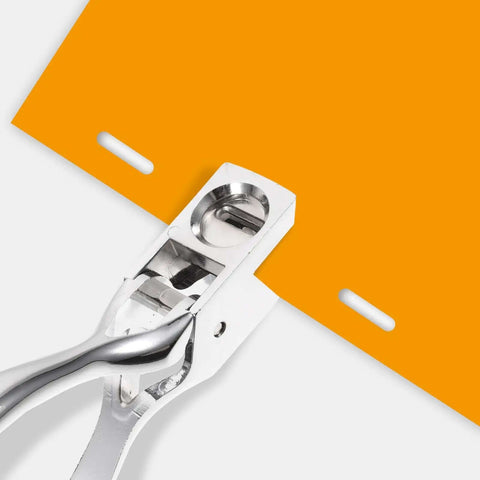 Manual Single Hole Paper Puncher for Office and School, 8 Sheet Capacity, silver oval puncher on orange paper