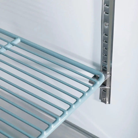 Close-up of sleek wire shelving rack inside Commercial Reach In Split Door Freezer With Dual Solid Doors And Twenty Three Cubic Feet Of Badass Cold Storage.