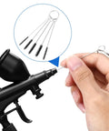 Pro Grade Carburetor Cleaner Kit Torch Tip Cleaner Set With 1 Single Head Brush, 5 Nylon Brushes, 23 Needles, 4 Cleaning Hooks, 1 Scraper, And a Handy Box Of Cleaners Tools For Motorcycles, ATVs, Welders, And Lawn Equipment, black torch tip cleaner brush set in hand