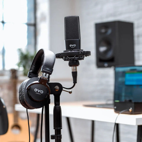 EVO4SRB Start Recording Bundle 2x2 USB Audio Interface For Mac PC iOS with SR1 mic, SR2000 headphones on a stand in a studio.