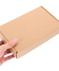 Person holding 10 Pack Paper Mailing Boxes For Shipping Compact Cardboard Mailer Boxes Flat Corrugated Packing For Small Items Moving Supplies Durable Kraft Packaging