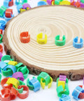 Durable 8mm Pigeon Leg Bands Set of 120, Numbered Clip On Bird Leg Bands displayed on wooden surface