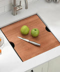 Wooden cutting board over undermount bar sink 13x15 inches 16 gauge stainless steel deep basin nine inch depth with three and a half inch drain.