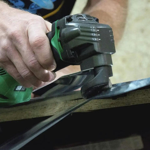 18V MultiVolt Cordless Shear Tool Only No Battery With 8 Cutting Edges And Two Sets For Easy Replacement For Long Lasting Service Life At 5300 RPM Built In Safety Protector Plate For Quick Clean Cuts being used on metal sheet