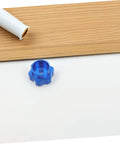 Blue Alloy Valve Stem Knob With 6mm Hole Replacement for outdoor water spigot on white and wooden background