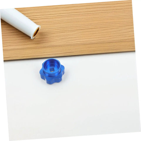 Blue Alloy Valve Stem Knob With 6mm Hole Replacement for outdoor water spigot on white and wooden background
