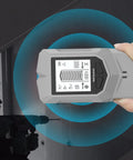 Wall Stud Finder Depth Recognition LCD Display Audio Alarm in hand, showing screen, detecting studs in wall.