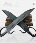 18 Inch Plastic Butterfly Swords Set Of 2 For Martial Arts Training Black Practice Blades Lightweight Durable Safe Swords For Beginners And Kids Realistic Look Without Metal crossed on wooden stand.