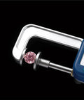 Jewelry-Making Digital Caliper,25mm Range,0.01mm Precision Thickness Gauge measuring a pink gem on a black background.