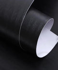 Removable Self Adhesive Wallpaper Roll For Waterproof Cabinet Makeover And Buttery Smooth Peel Stick Furniture Wrap With Authentic Wood Grain Look, showing a black wood grain vinyl roll.