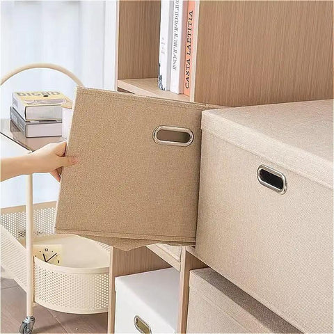 Heavy Duty Fabric Storage Bins With Snap On Lids Stackable Khaki Storage Boxes textured cover being pulled from shelf.