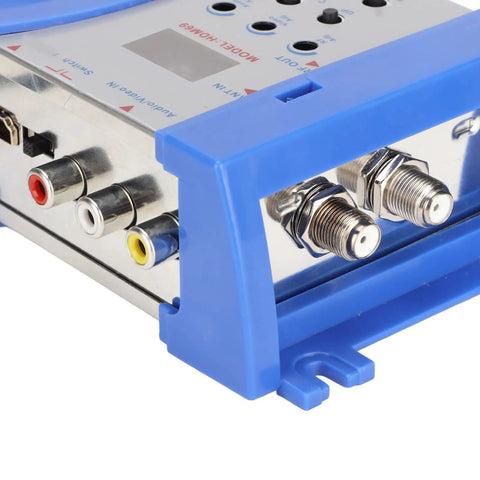 Close-up of HDMI To RF Modulator For TV With PAL NTSC Support, featuring RF converter ports, dual frequency connections, blue casing.