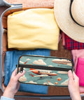 Person packing Cartoon Airplane Travel Toiletry Bag For Men With Hanging Kit Dope Travel Gear Waterproof Shaving And Wash Bag in suitcase