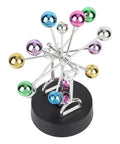 Colorful mirrored balls on a Battery Powered Newton Pendulum Ball Desktop Toy For Science Nerds Newton's Cradle Style Desk Decor.