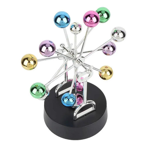 Colorful mirrored balls on a Battery Powered Newton Pendulum Ball Desktop Toy For Science Nerds Newton's Cradle Style Desk Decor.