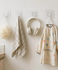 Sick Wall Mount Hooks, Totally Rust Proof Storage Rack For Coats, Bags, And Picture Hanging, clear hooks holding towel, pouf, headphones, and kid's dress.