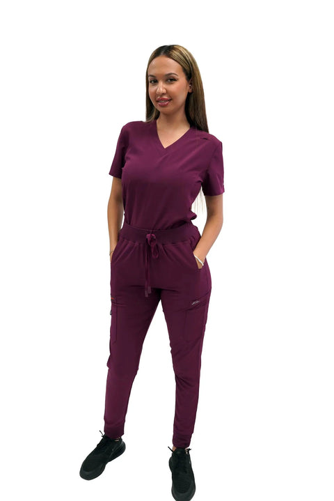 Women's Slim High Waisted Jogger Scrub Pants Yoga Style Nursing Uniforms Wine Color worn by model, showcasing tapered design and pockets.