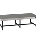 Badass Heavy Duty Welding Fixture Table With Laser Etched Two Inch Grid And Sixteen Millimeter Clamp Holes Precision Leveling Feet Ten By Five Foot Steel Workbench Made In Usa viewed from the side.