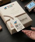 Handheld Portable Date Code Printer With Two Refillable Ink Cartridges Adjustable Dual Nozzle Setup For Crisp Text And QR Codes On Bags And Boxes; packaging with label and tag on wood surface.