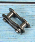 Heavy Hitter Stainless Steel Chain Master Links For Bikes And Cycles No Sweat Connector Repair Parts Rustproof Build, shown from the side.