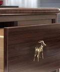 Kickass Solid Brass Cabinet Knobs With Super Sweet Retro Animal Drawer Pulls For Kitchen Cupboards Heavy Duty Furniture Hardware Featuring Smooth Adjustable Cuttable Step Screws on a wooden drawer.