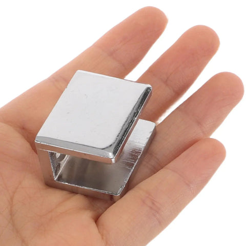 Built Like A Tank Zinc Alloy Glass Shelf Clamps For Bathroom Shower Panels Six Piece Set Anti Scratch Heavy Duty Wall Mount Support Fits 10 To 12 Millimeter Glass Straight Up Tight Fit in hand.