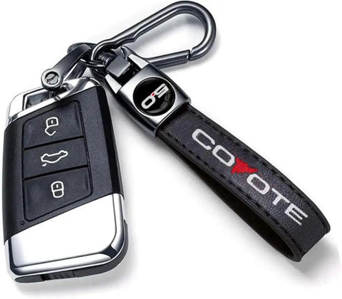 Premium Leather Car Keychain With Coyote 5 0 Emblem And Built In Screwdriver Tool Heavy Duty Alloy Ring For Ford Mustang Rides, close-up view.