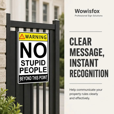Warning sign on a fence reading 'No Stupid People Beyond This Point' with clear messaging and instant recognition emphasis.
