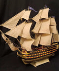 3D Wooden Ship Puzzle Kit For Adults 1:200 Laser-Cut HMS Victory Model with detailed sails and rigging on display.