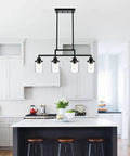 Dope Five Light Black Modern Chandeliers With Clear Glass Shades Industrial Pendant Lights in a kitchen setting